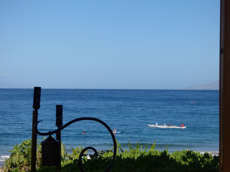 A view of the ocean with a boat in the distance