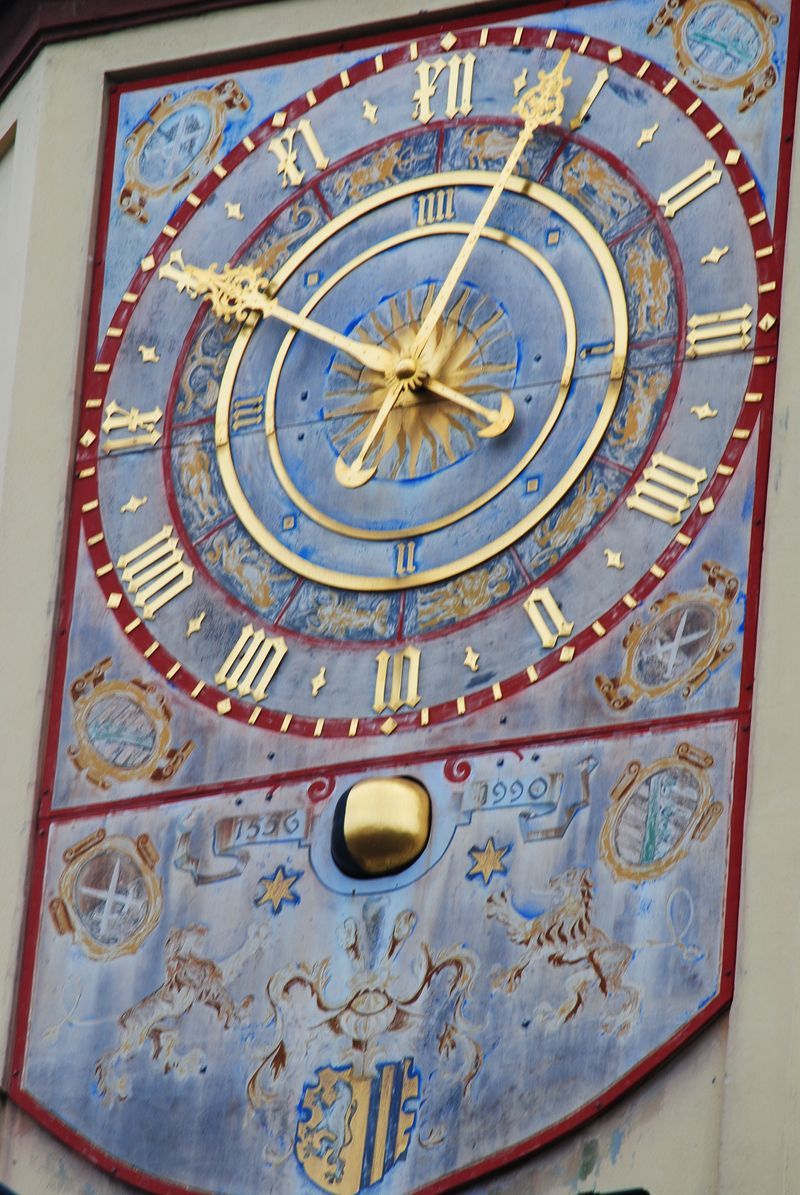 A clock on a wall shows the time as 4:20