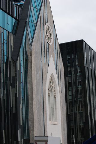 A large building with a clock on the side of it