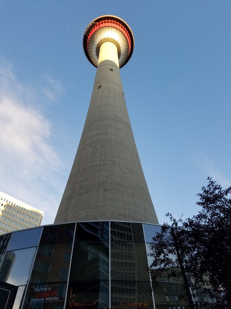 Looking up at a tall tower with a blue sky in the background
