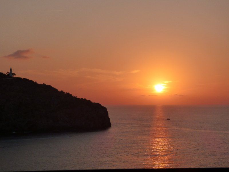 The sun is setting over a body of water