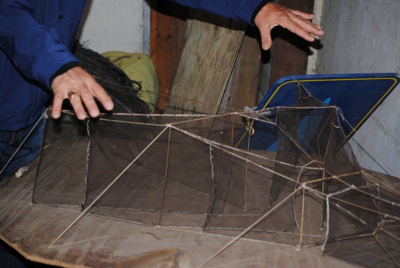 A person is holding a fishing net in their hands