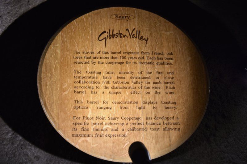 A wooden barrel with writing on it that says gibston valley