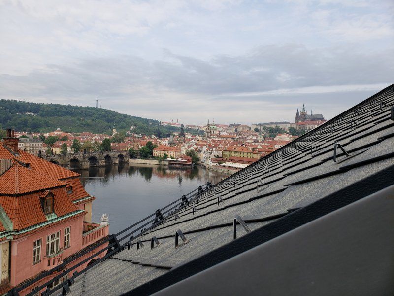 A view of a city from the roof of a building.