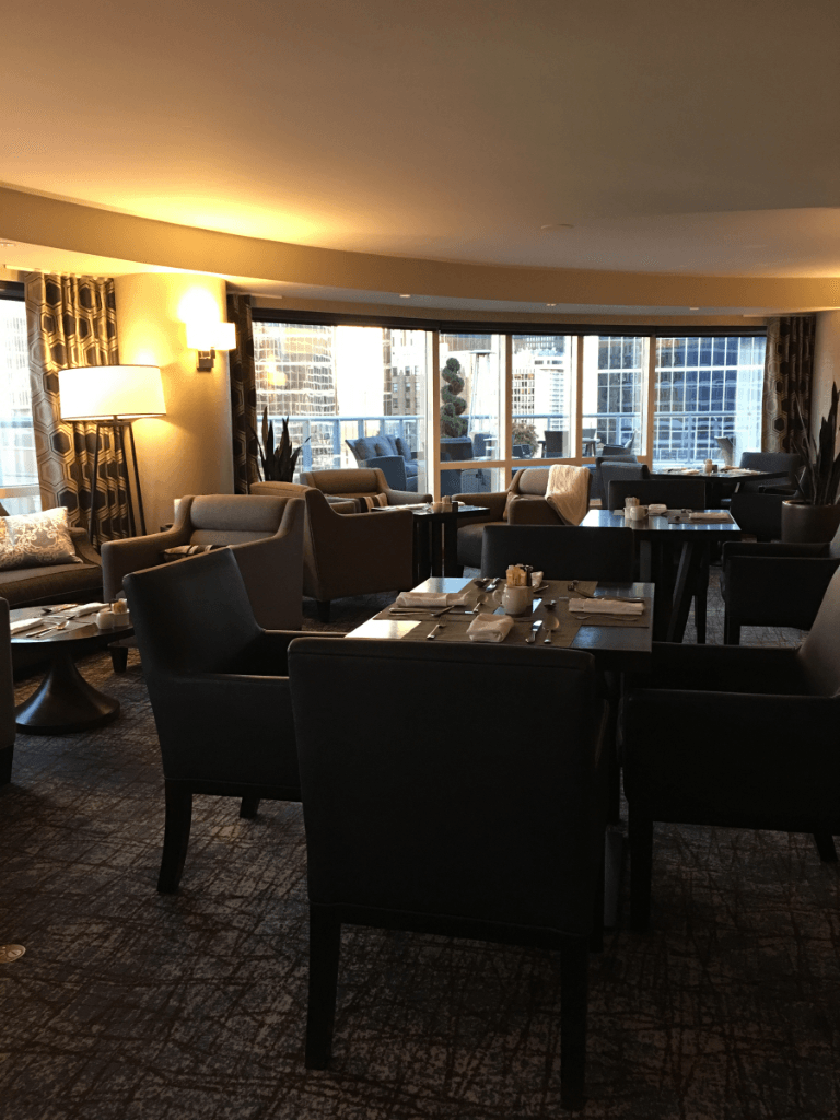 A large room with tables and chairs in it