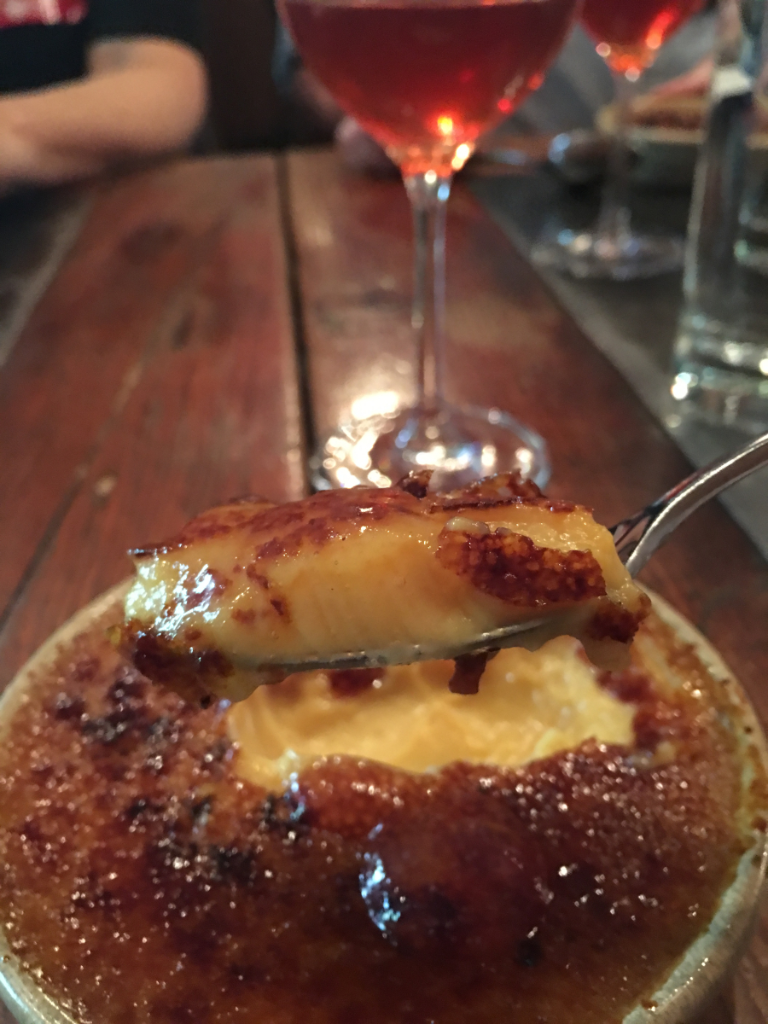 A close up of a dessert with a spoon in it