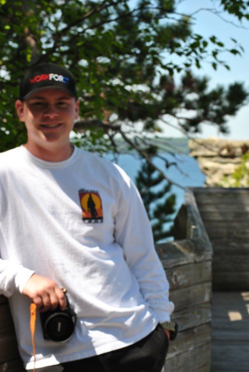 A man wearing a hat with the word fcs on it