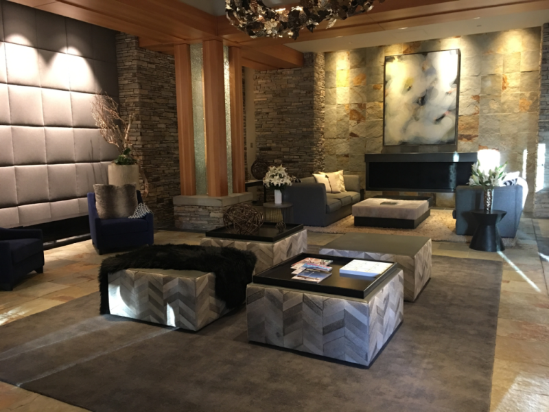 A living room with a lot of furniture and a fireplace