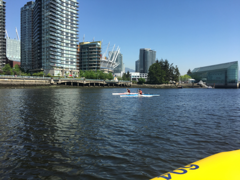 A yellow paddle board with the number 404 on it