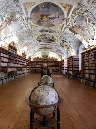 There is a globe in the middle of the library.
