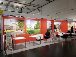 A large room with tables and chairs in it