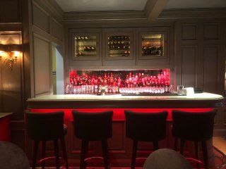 A bar with a lot of bottles on it