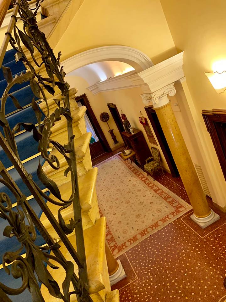 An aerial view of a staircase with a wrought iron railing