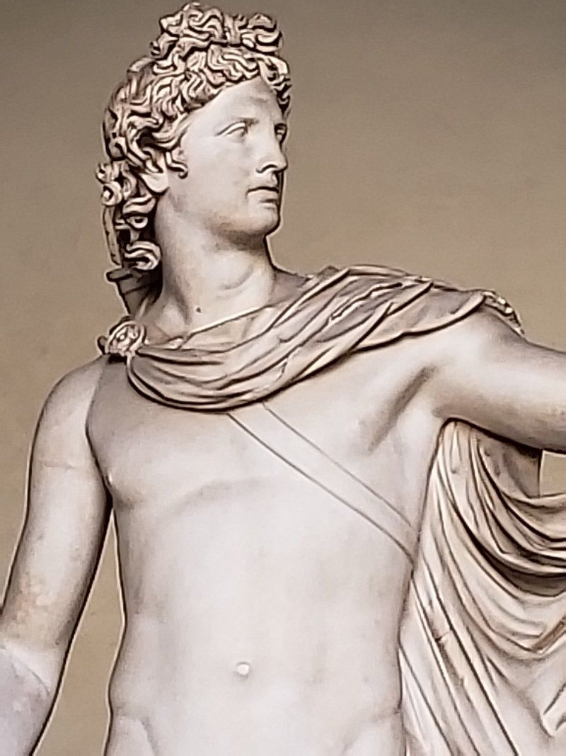 A close up of a statue of a man with a cloth around his neck