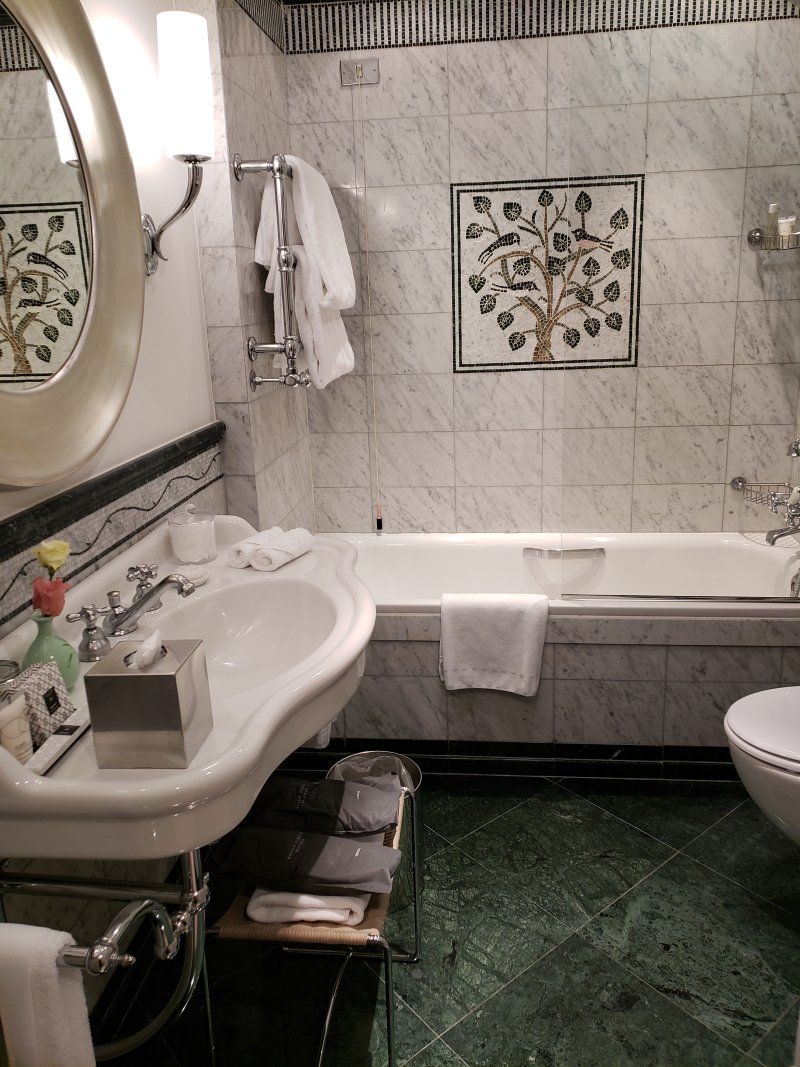 A bathroom with a sink a toilet and a bathtub