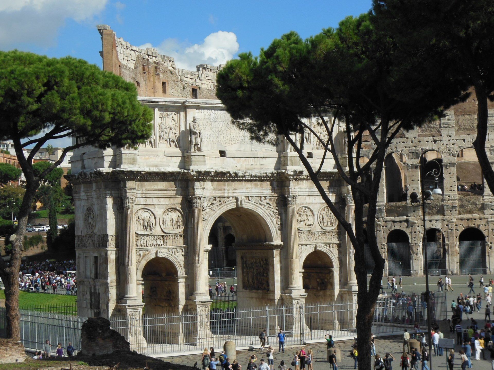A group of people are standing in front of a large building