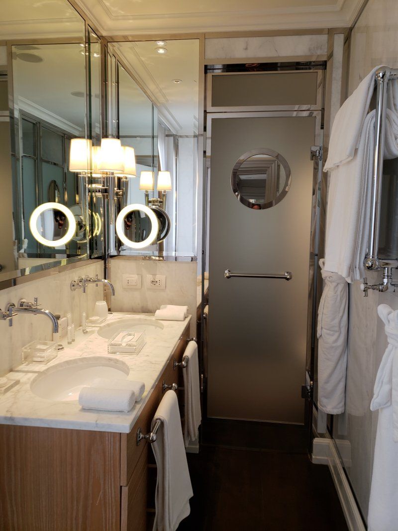A bathroom with two sinks and a mirror