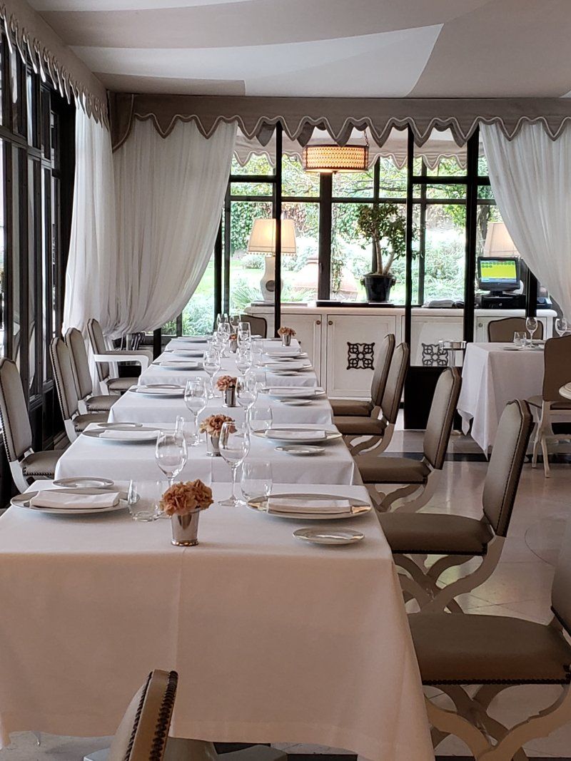 There are many tables and chairs in the restaurant.