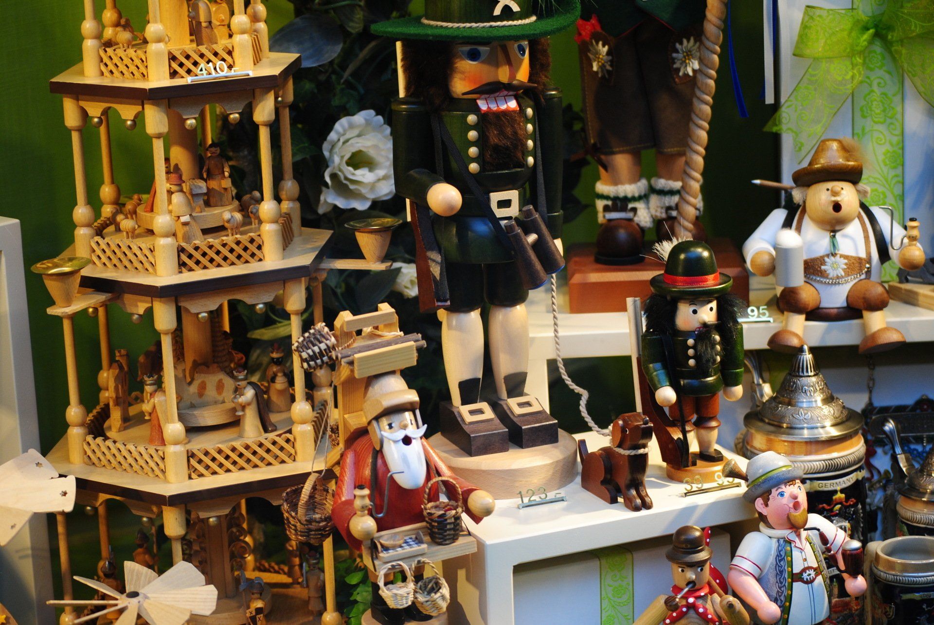 A display of wooden toys including a nutcracker