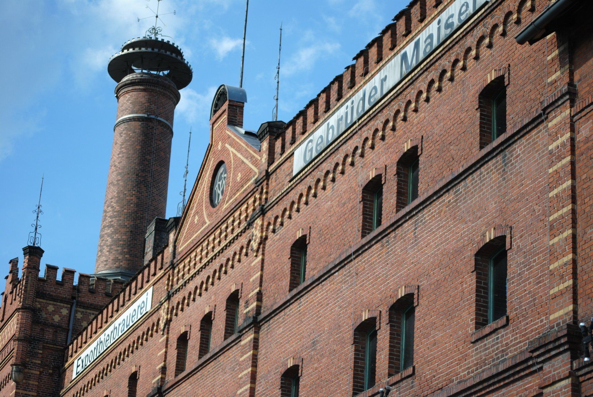 A large brick building with a chimney on top of it
