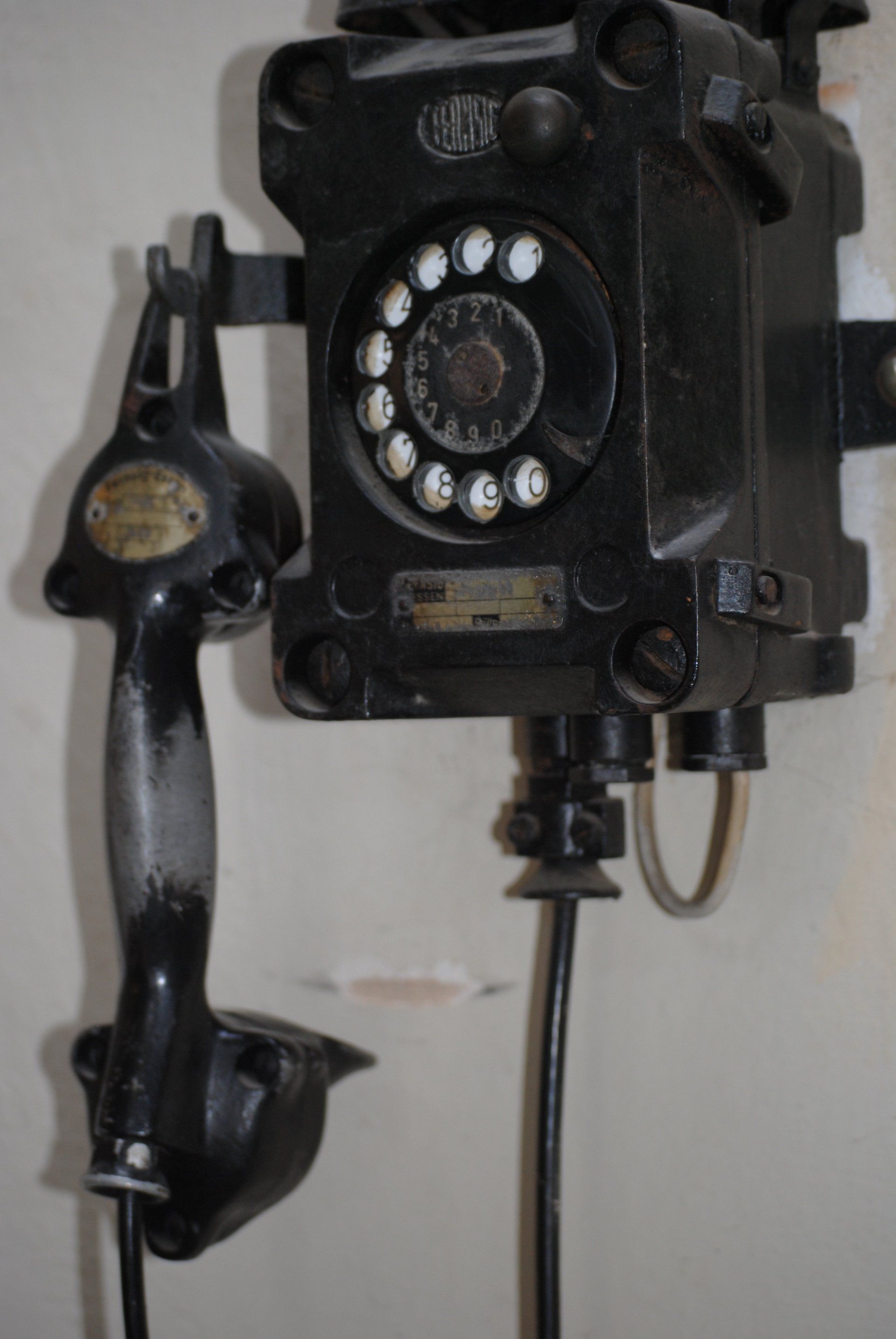 A black telephone with the number 666 on it