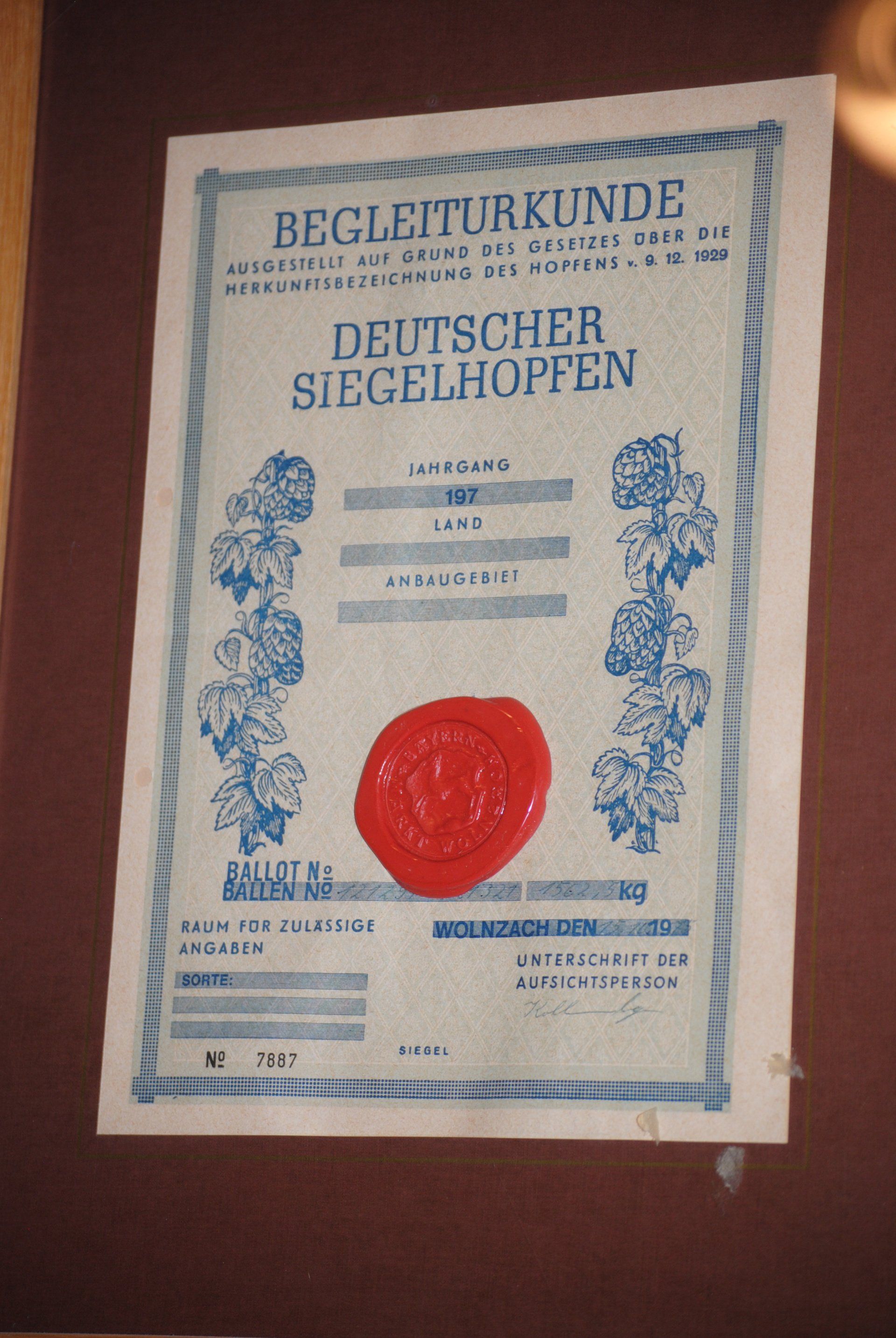 A certificate with a red wax seal that says deutscher siegelhoffen