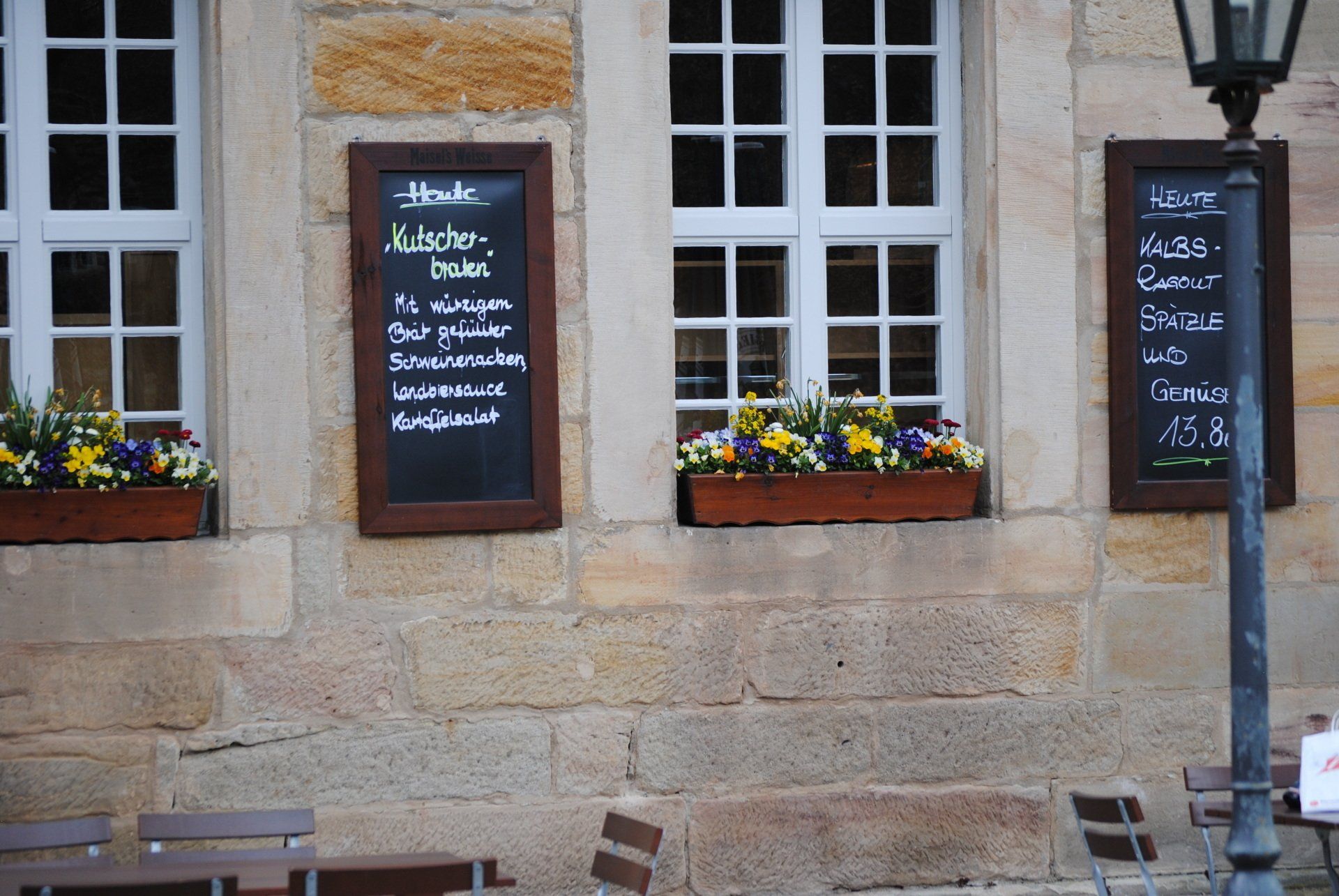 A chalkboard on the side of a building says buffet