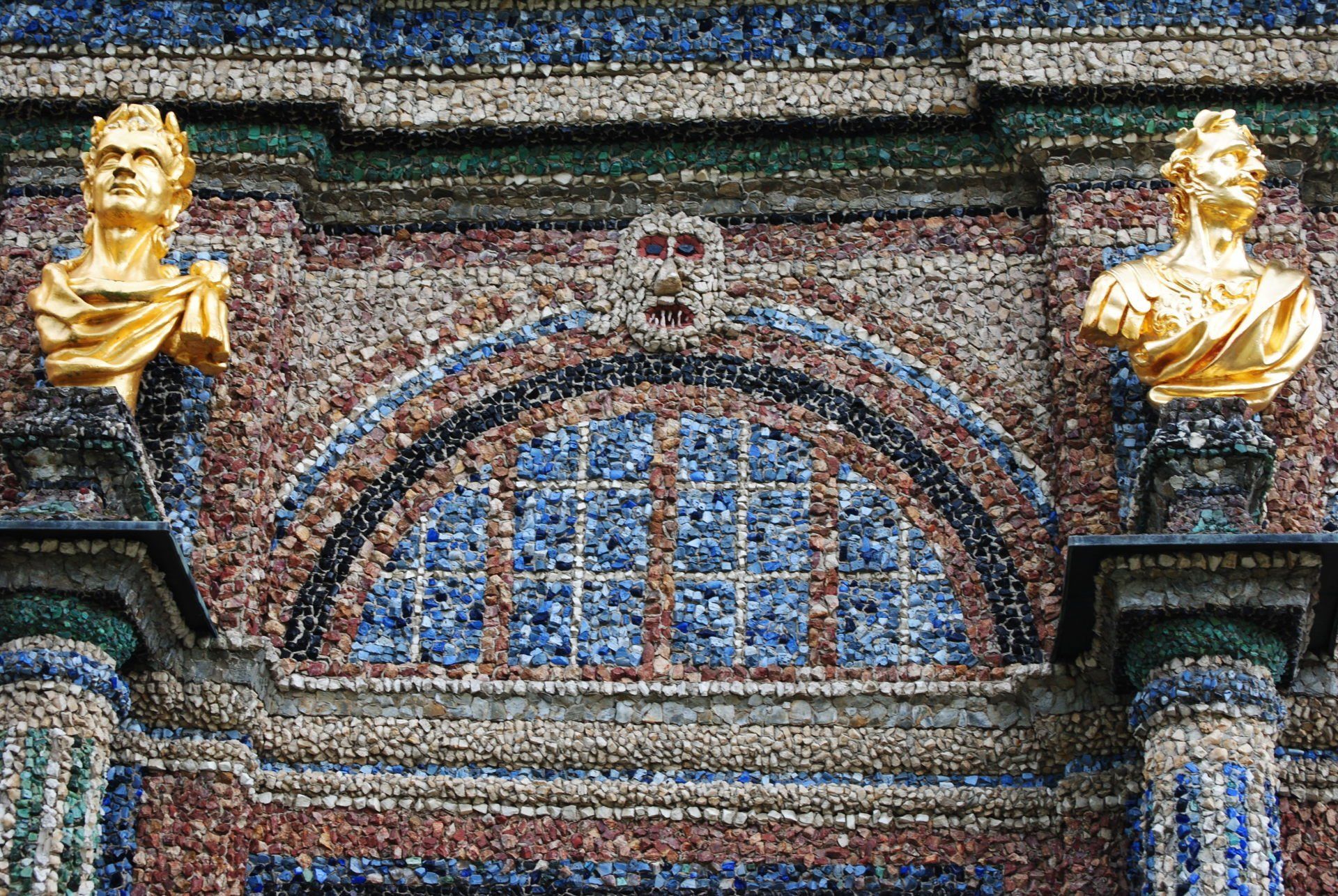 A statue of a man and a woman on a building