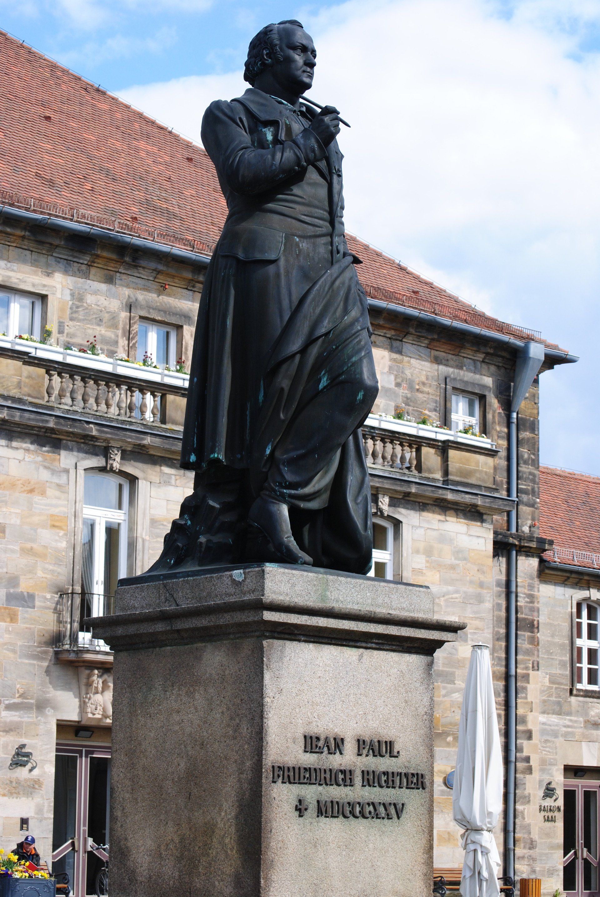 A statue of a man with the name jean paul on it