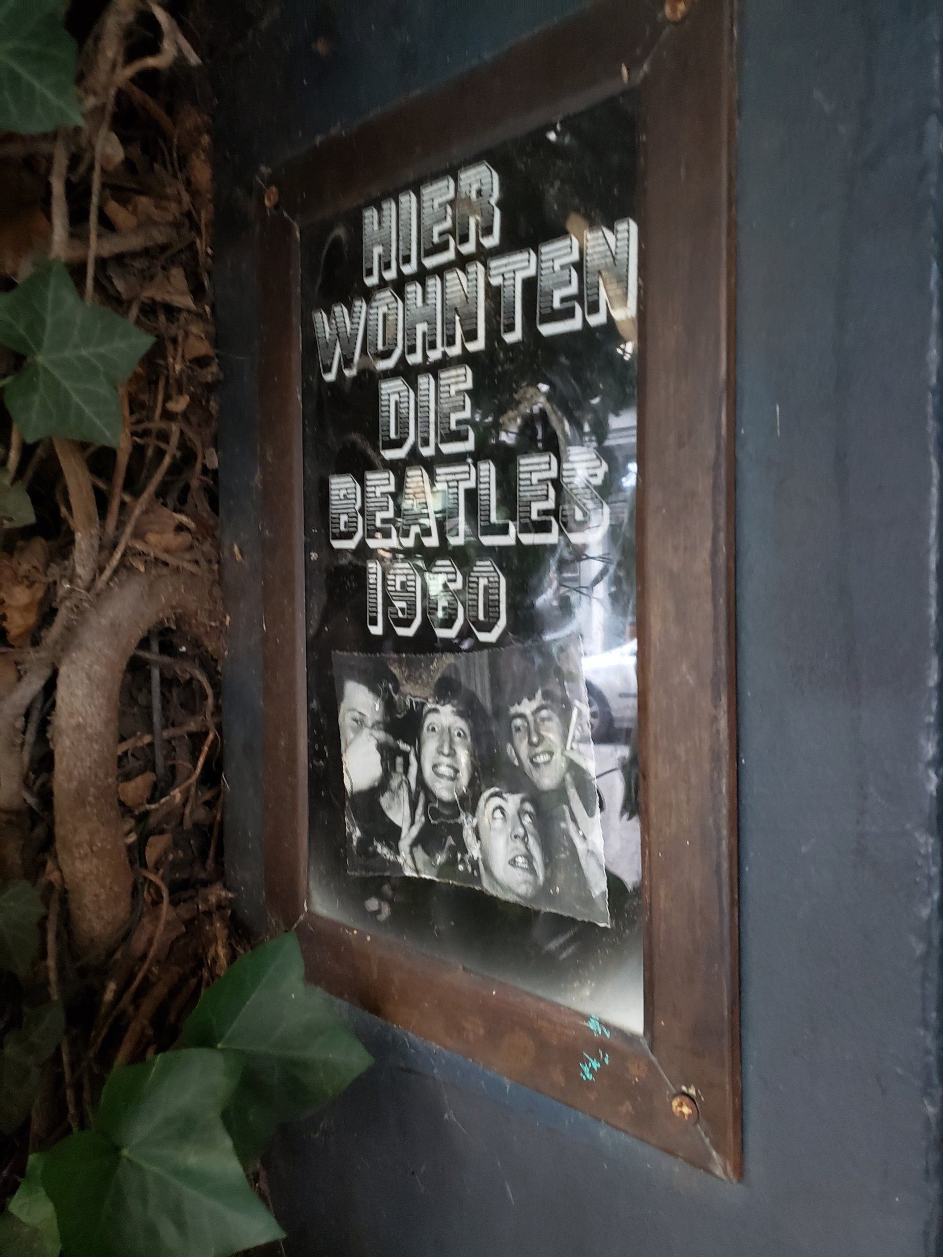 A mirror with a picture of the beatles on it