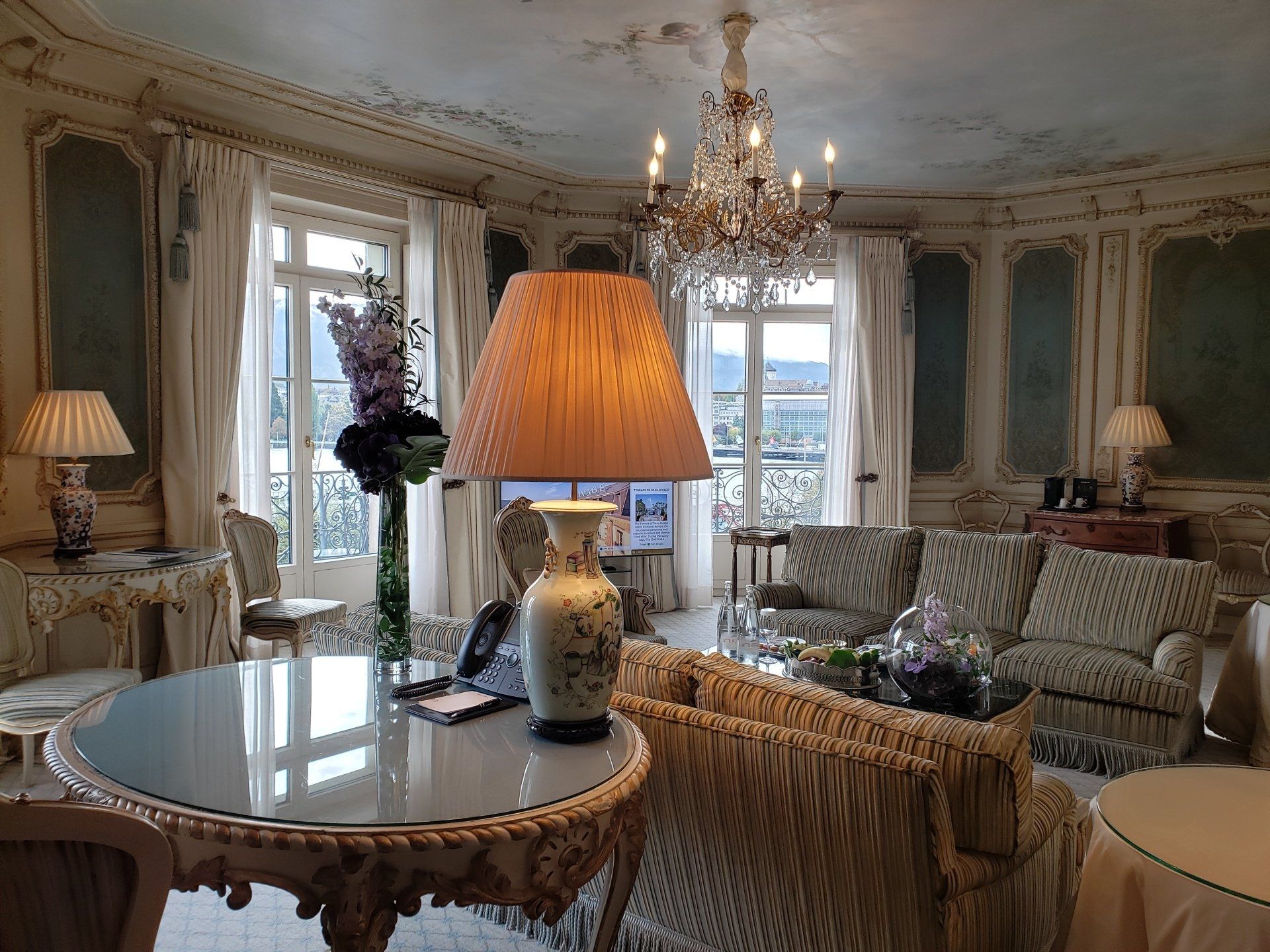 A living room filled with furniture and a lamp.