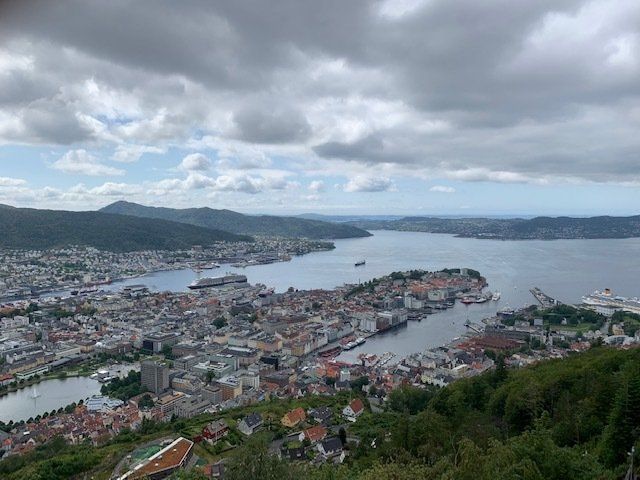An aerial view of a city with a large body of water in the background.