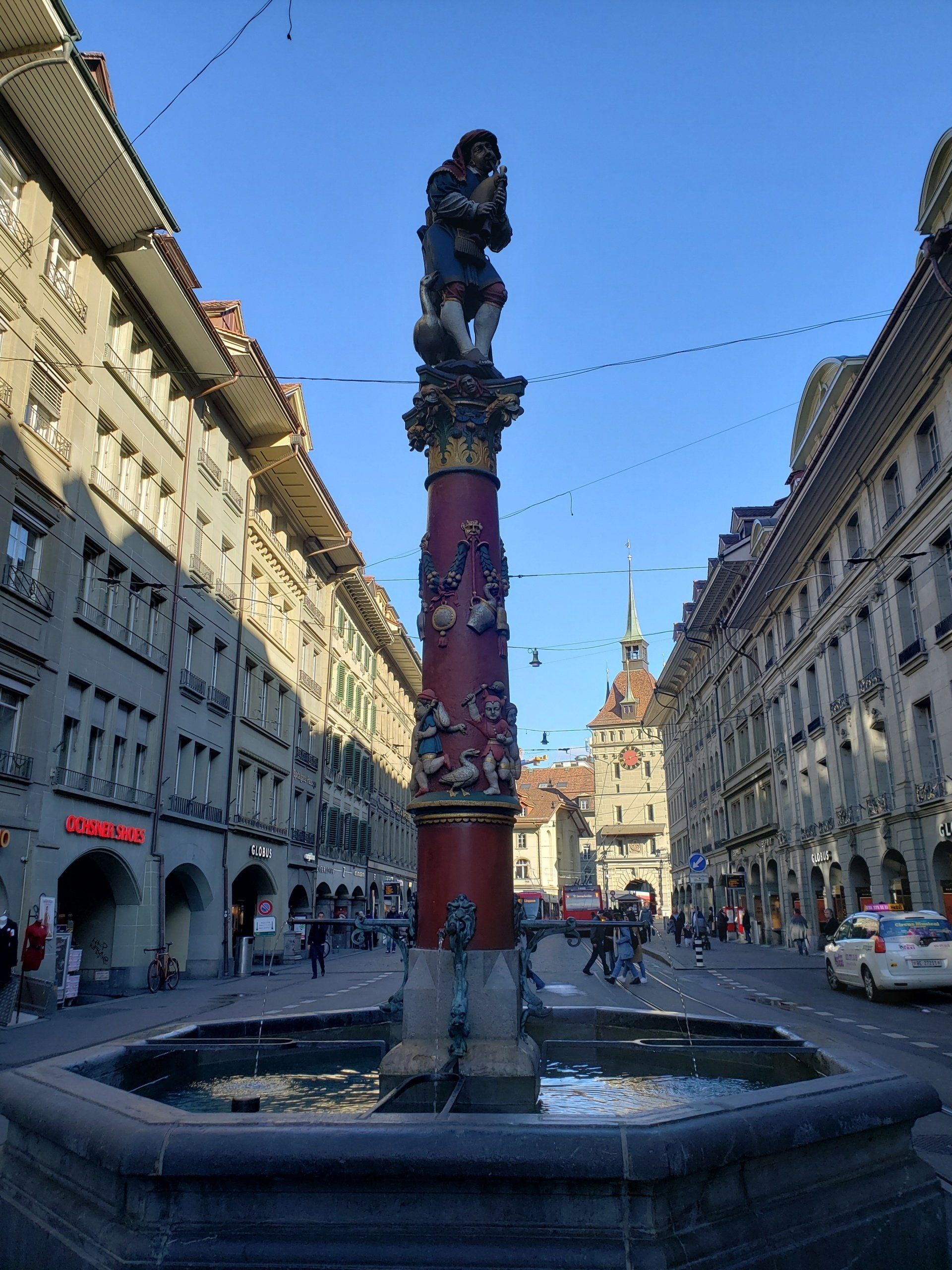 A fountain in the middle of a city street