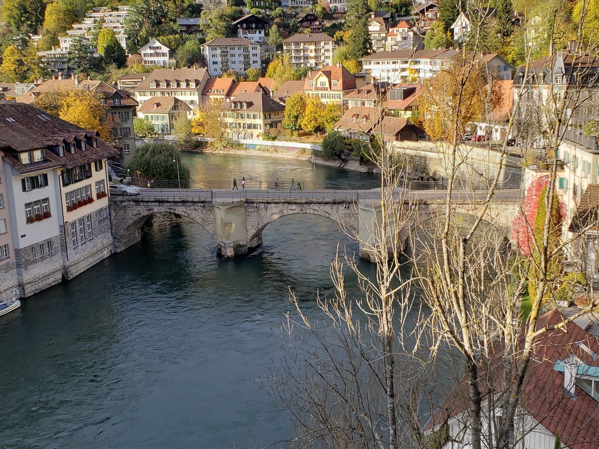 There is a bridge over a river in the middle of a city.