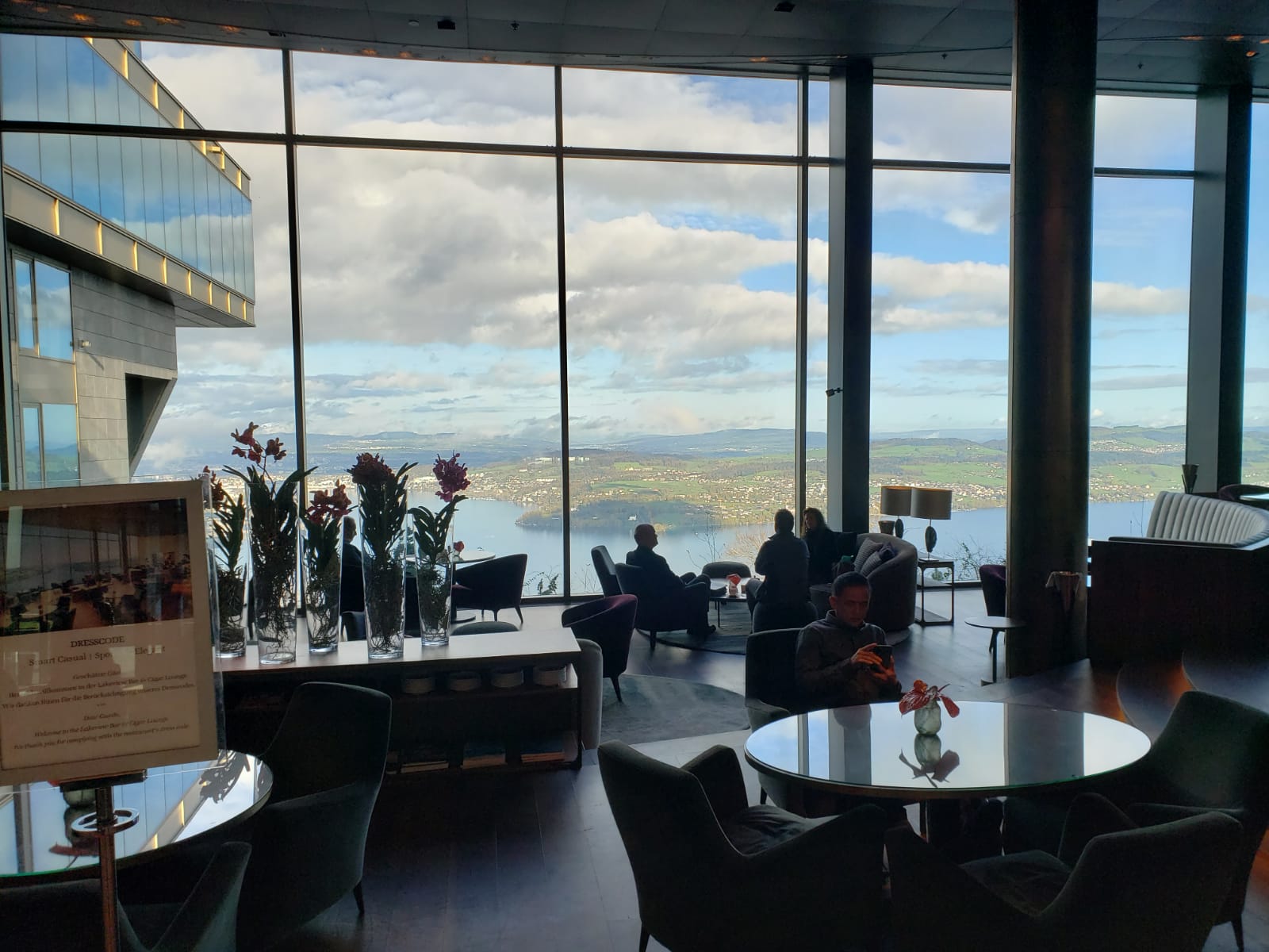 A large room with a view of a body of water