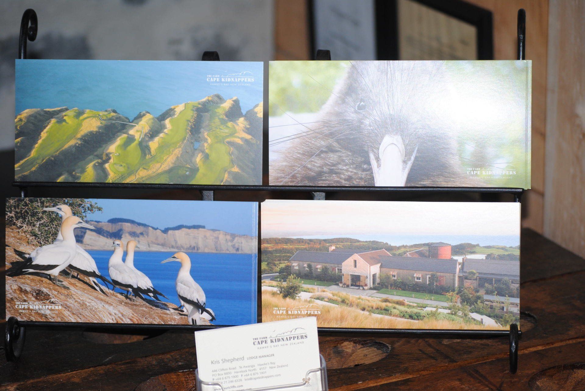 Four paintings are displayed on a table with a sign that says ' i 'm lovin ' it '