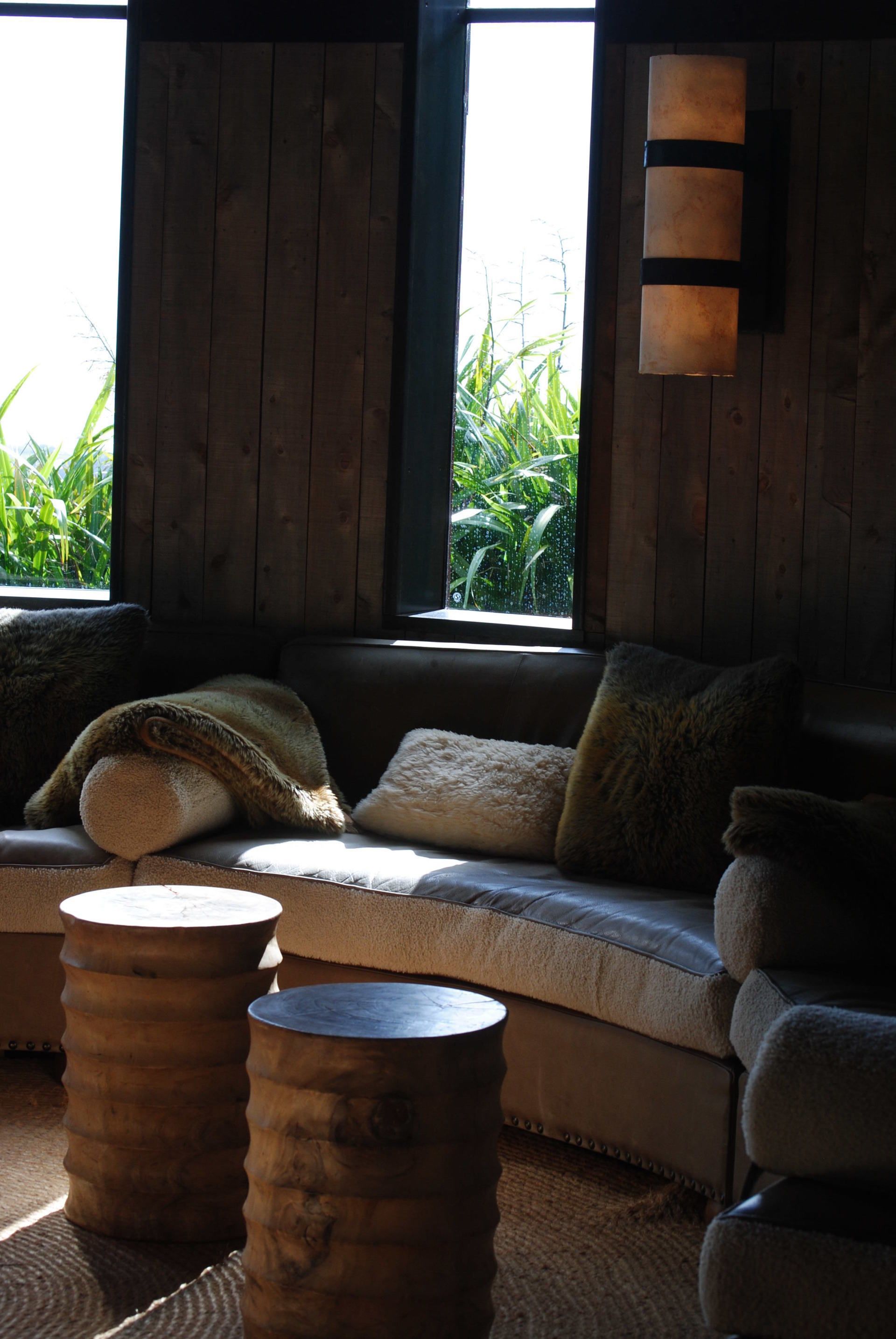 A living room with a couch and two tables