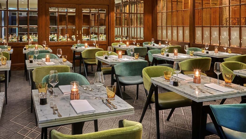 A restaurant filled with tables and chairs and candles.