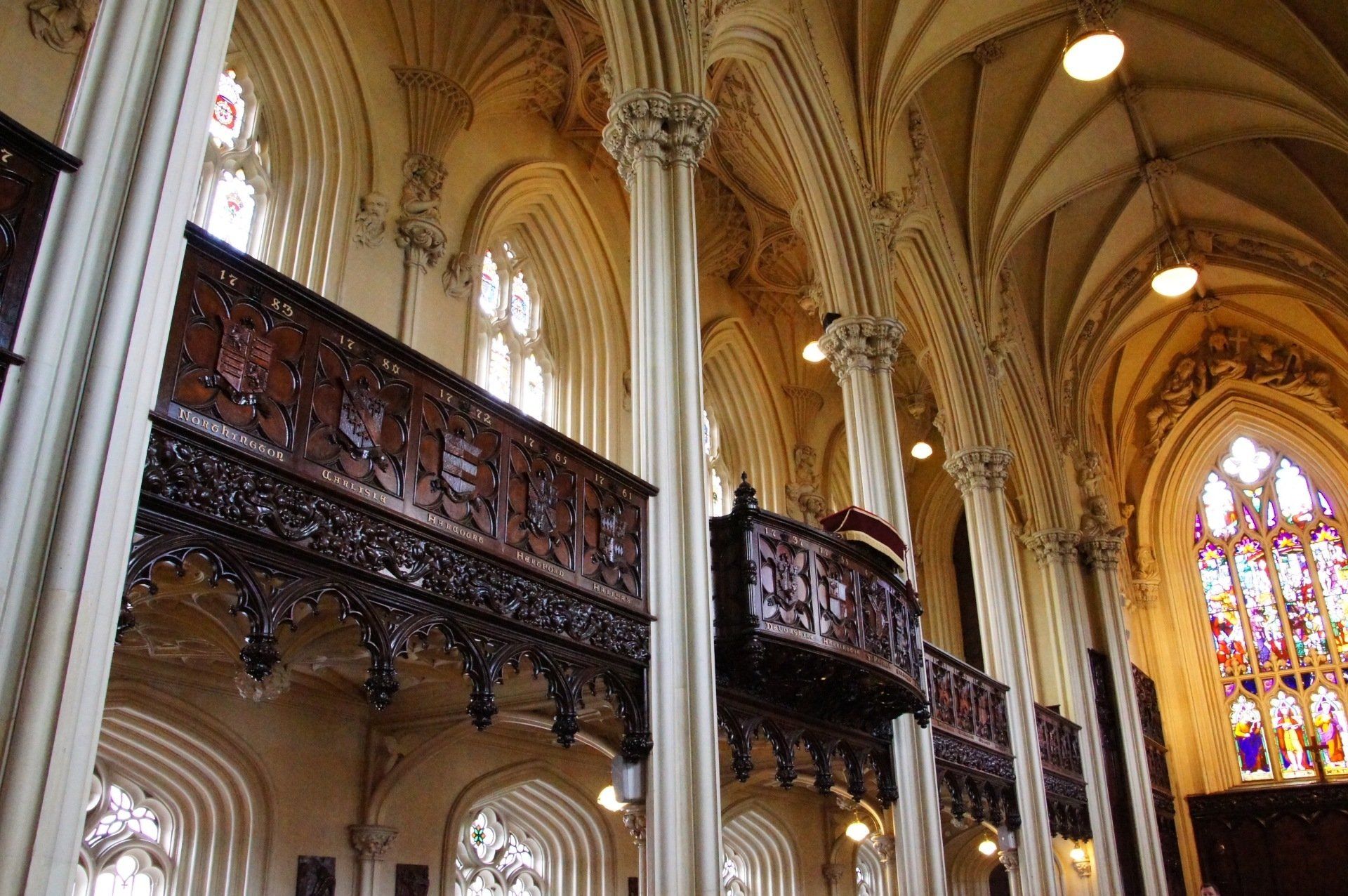 A church with a balcony and stained glass windows
