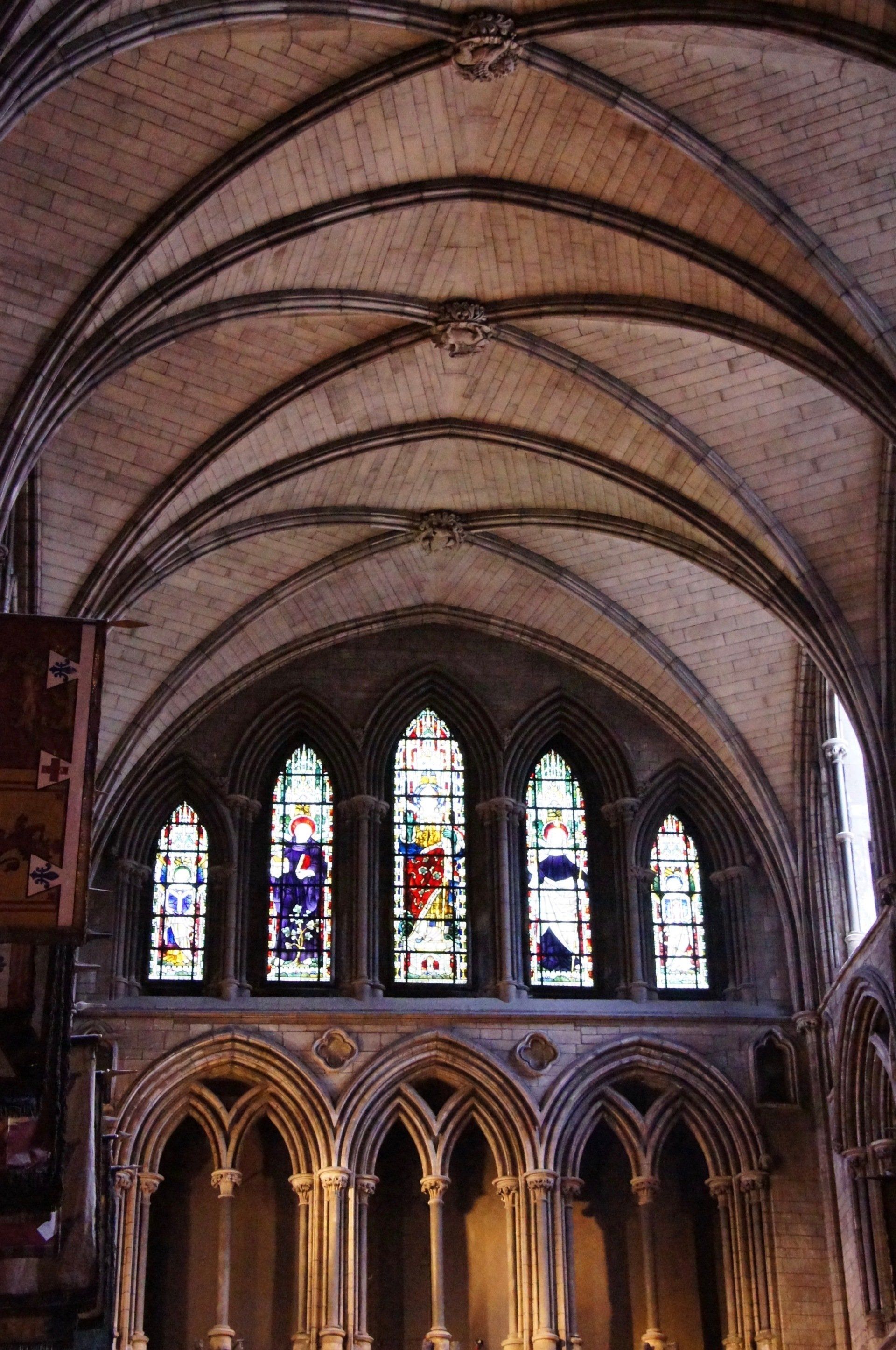 A church with a vaulted ceiling and stained glass windows