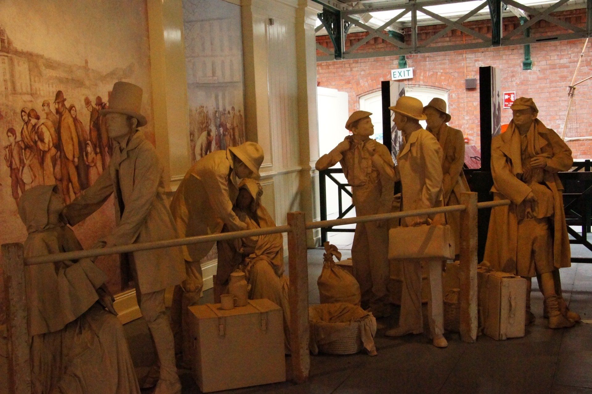 A group of people are standing next to each other in a room.