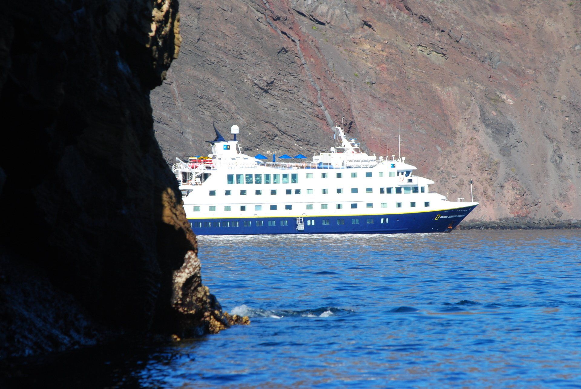 A large cruise ship is floating in the ocean