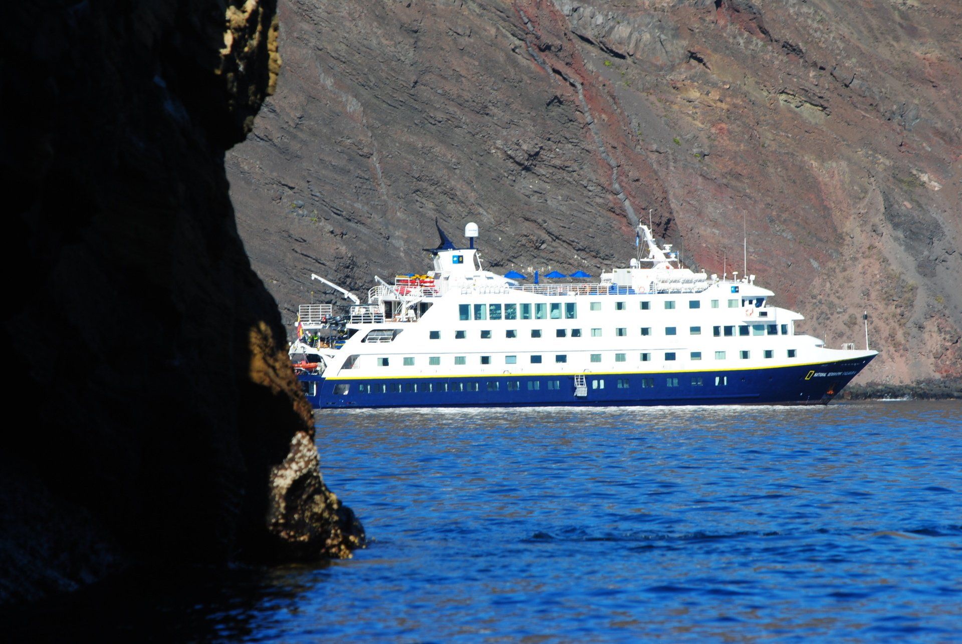 A large cruise ship is floating in the ocean