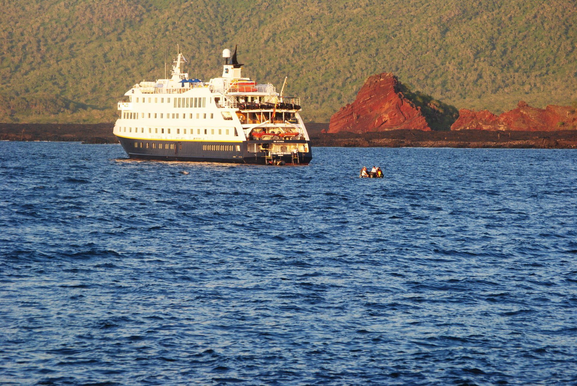 A large cruise ship is in the middle of the ocean