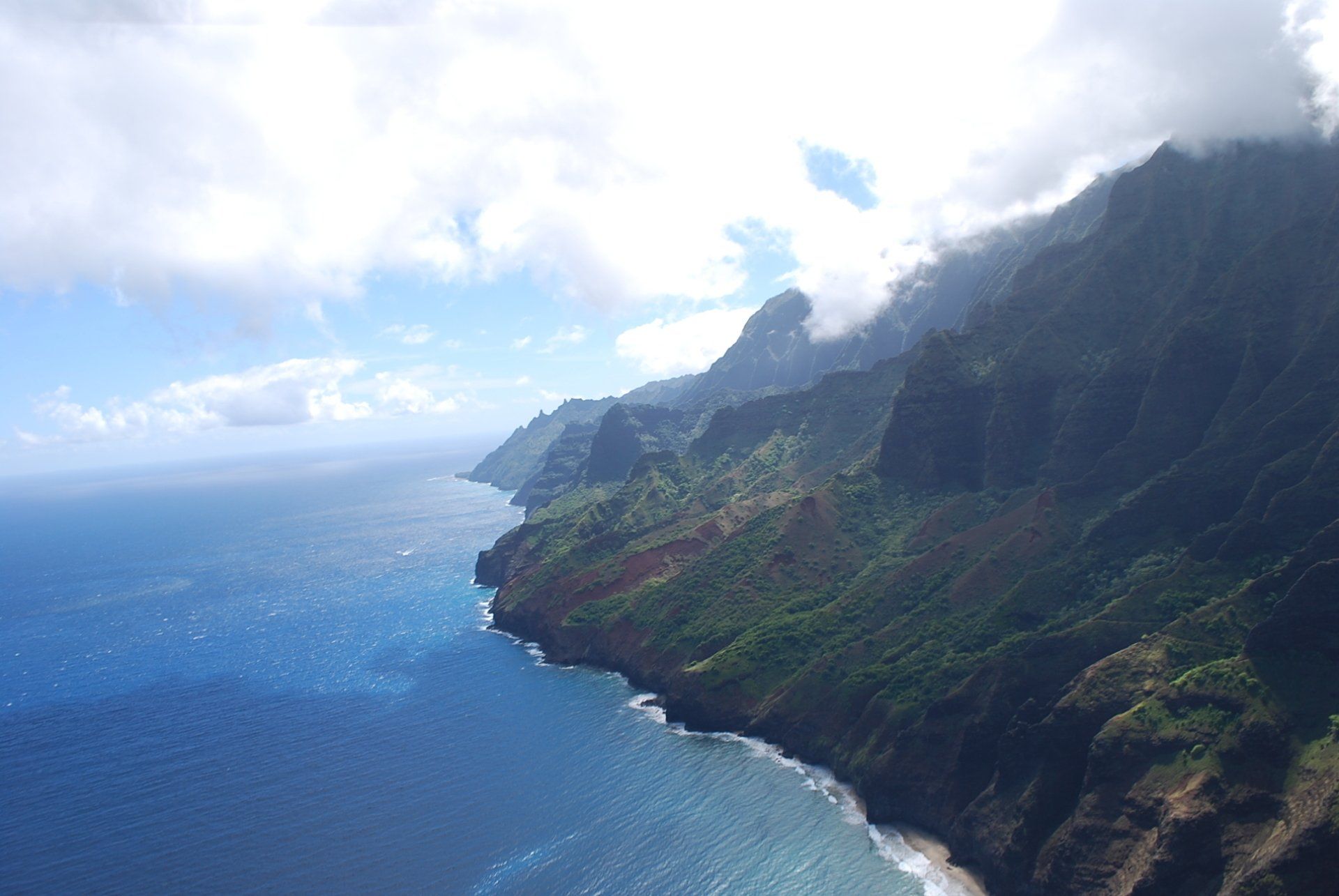 An aerial view of a cliff overlooking the ocean