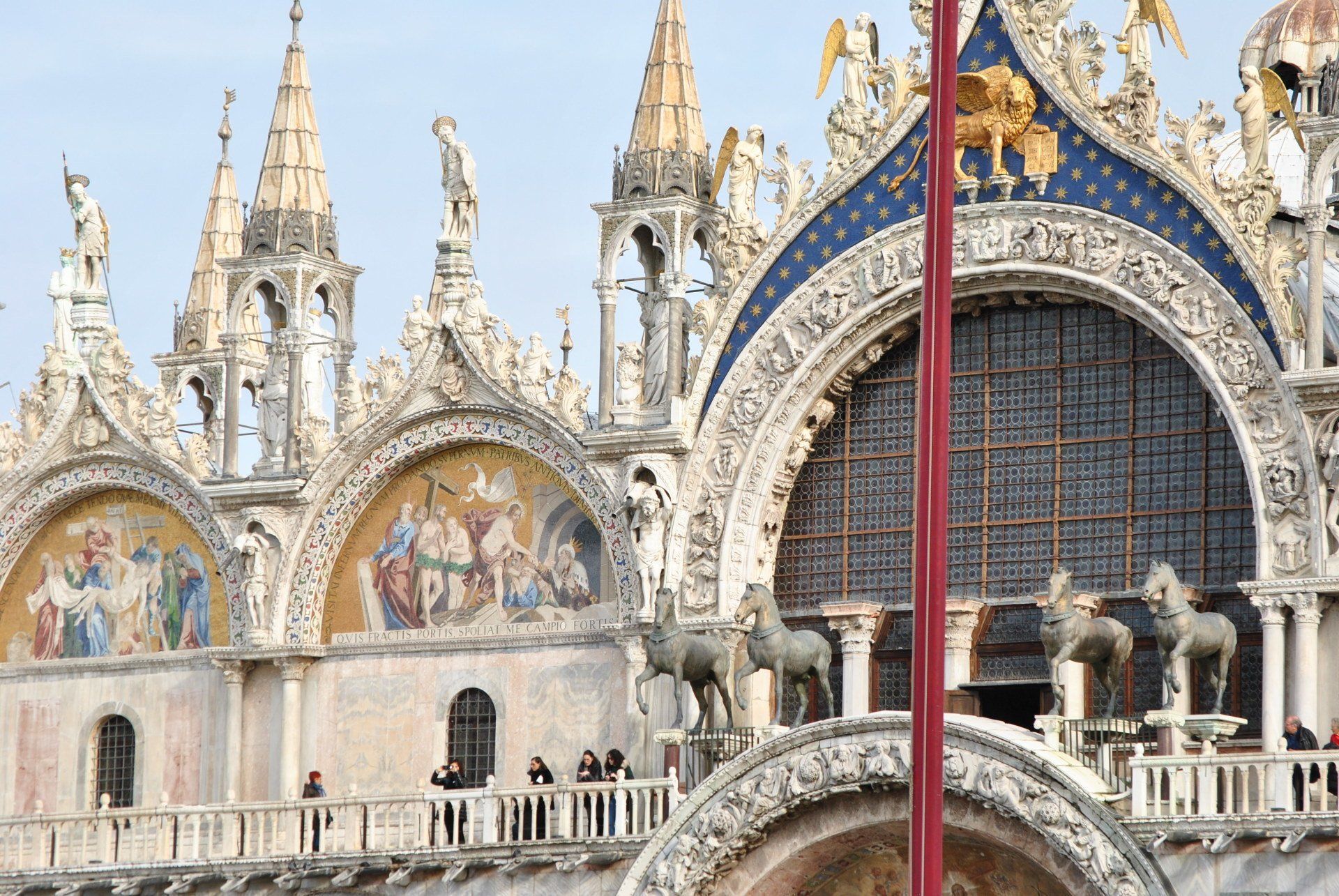 A large building with a red pole in front of it