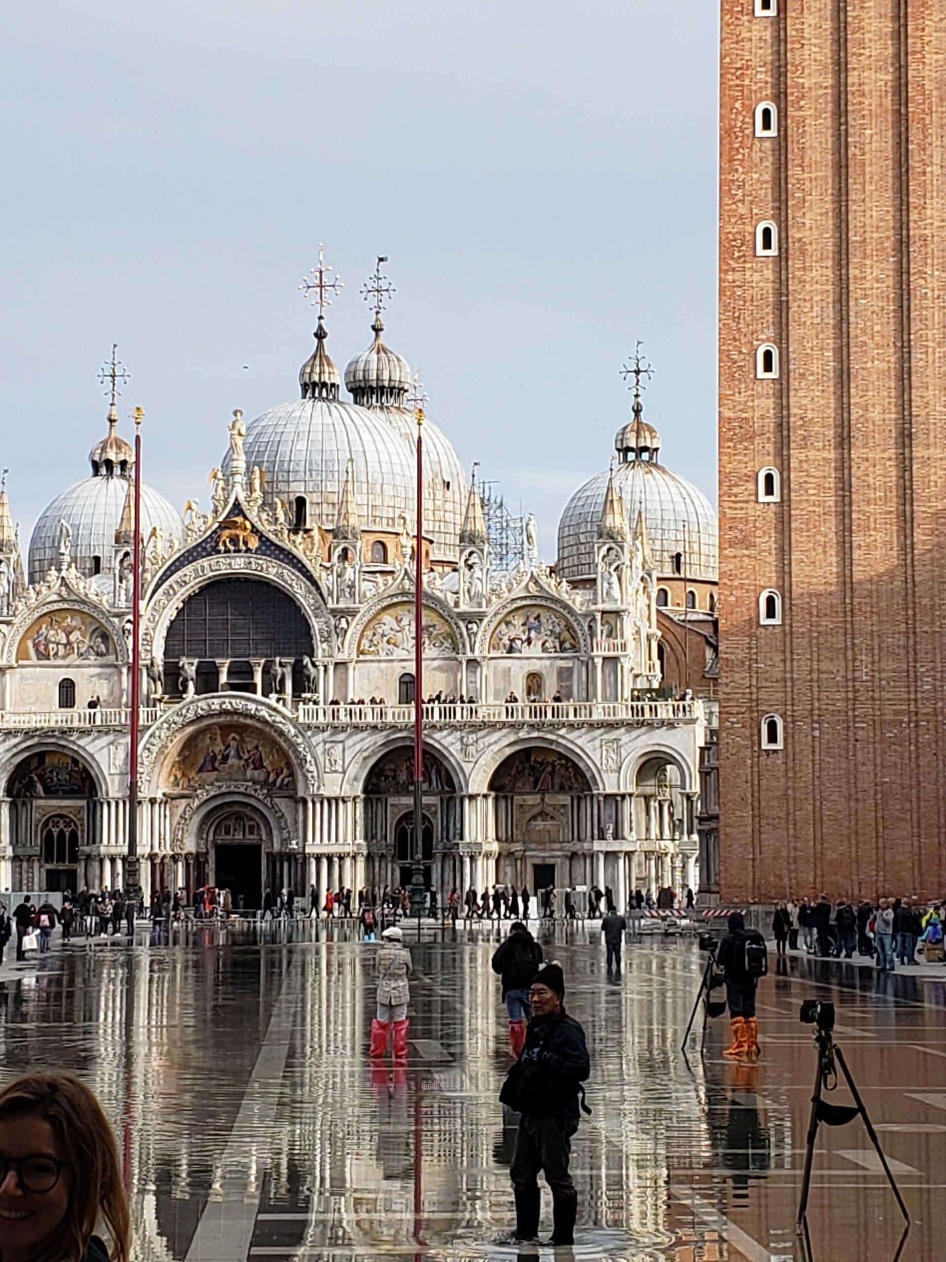 A group of people standing in front of a large building