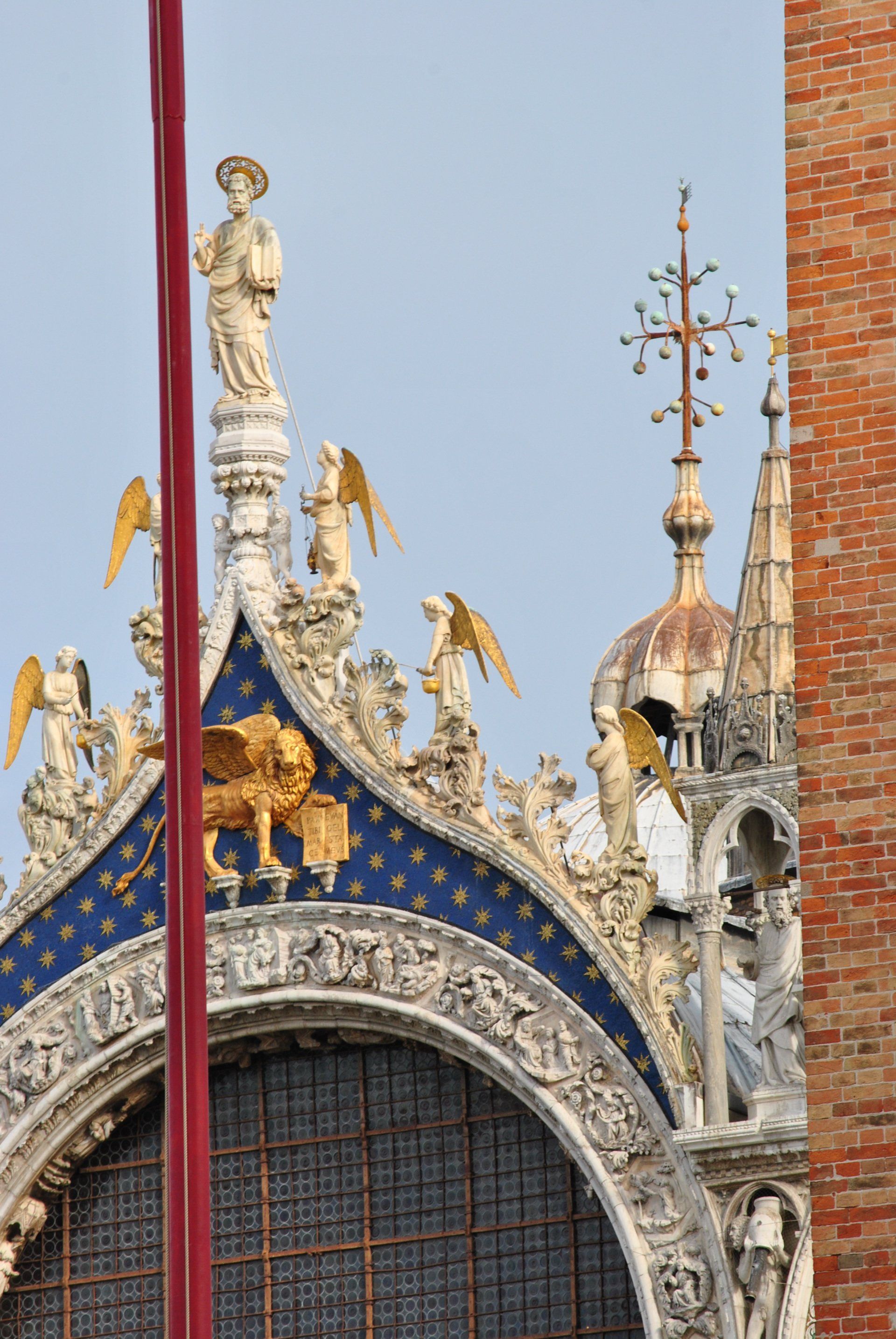 A church with a statue of a lion on top of it