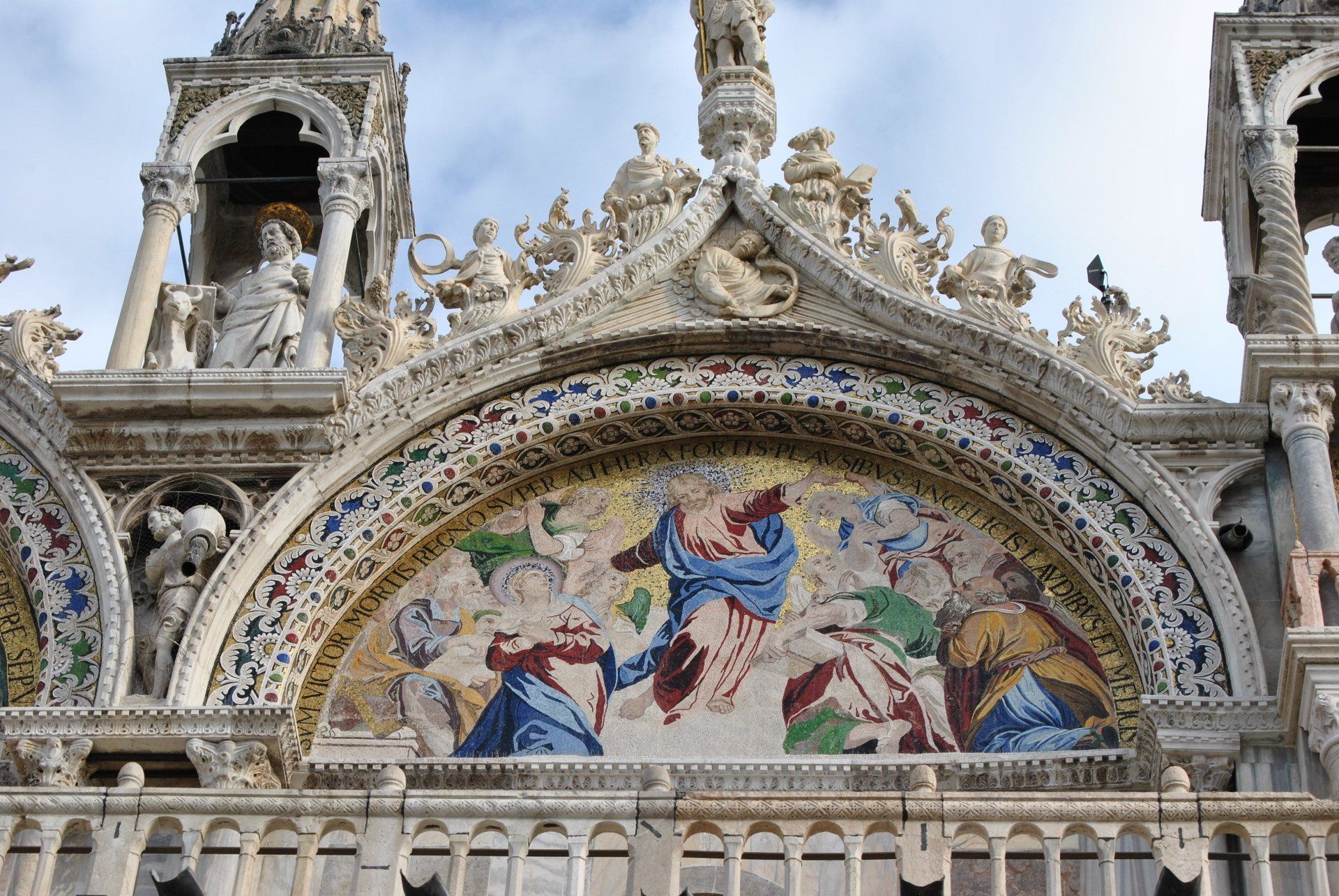 A church with a mosaic on the front of it