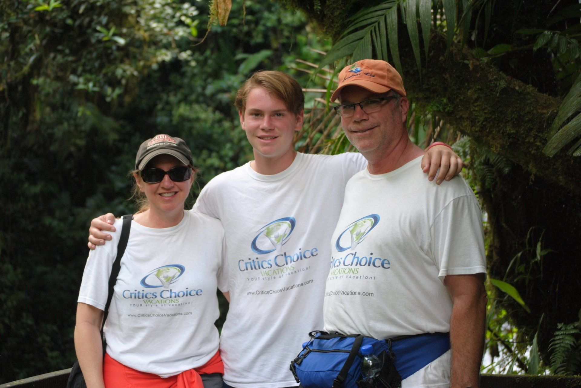 Three people are posing for a picture and one of them is wearing a shirt that says city choice